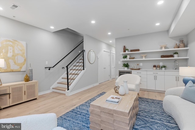 living room with light hardwood / wood-style floors