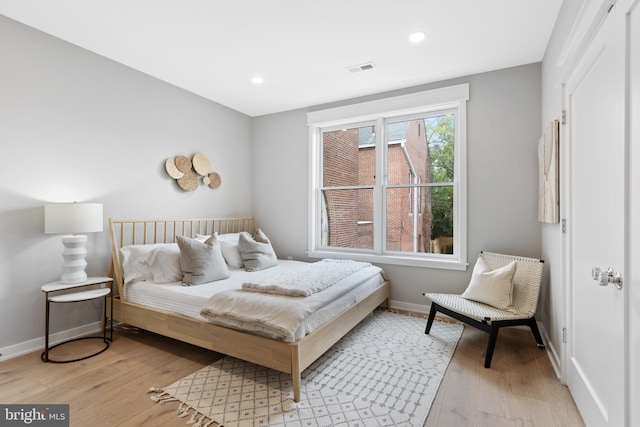 bedroom featuring light hardwood / wood-style floors