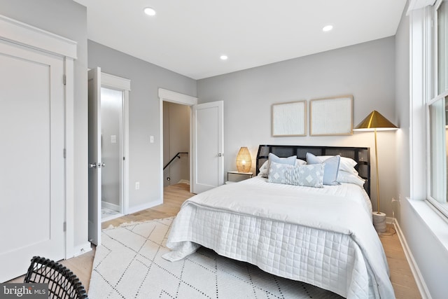 bedroom with light hardwood / wood-style flooring