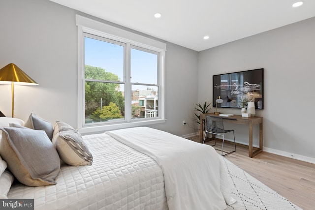 bedroom with light wood-type flooring