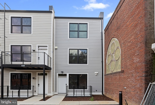 rear view of house with a balcony