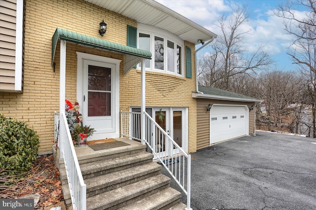 entrance to property featuring a garage