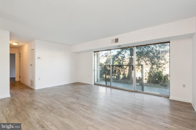 empty room featuring light hardwood / wood-style floors