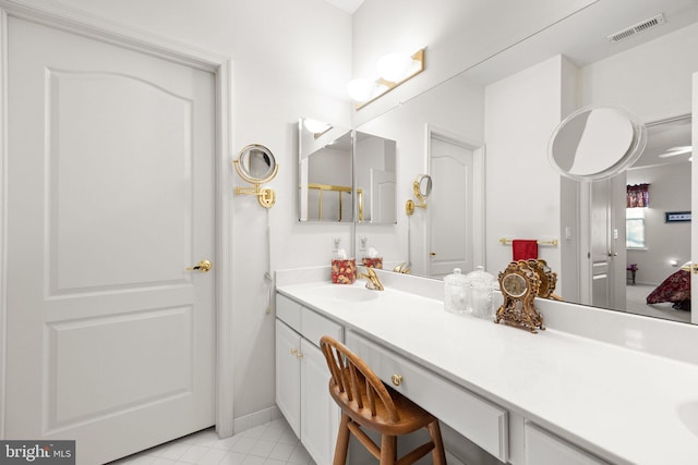 bathroom featuring vanity and tile patterned flooring