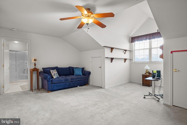 interior space with lofted ceiling, light carpet, and ceiling fan