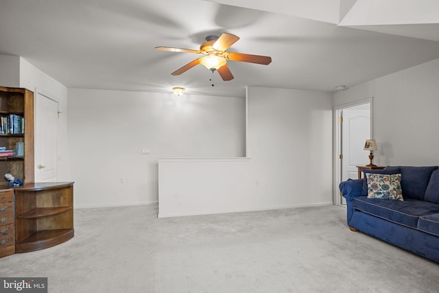 living room with ceiling fan and light carpet