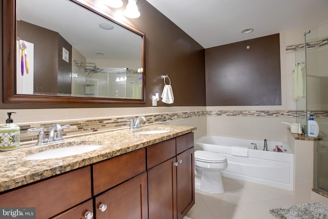 full bathroom featuring vanity, plus walk in shower, tile patterned flooring, toilet, and tile walls