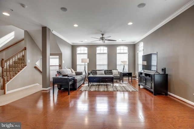 living room with ceiling fan, ornamental molding, and hardwood / wood-style flooring