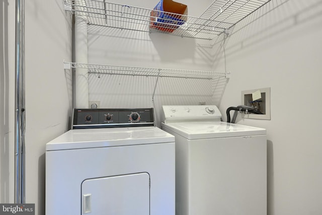 laundry area with washing machine and dryer