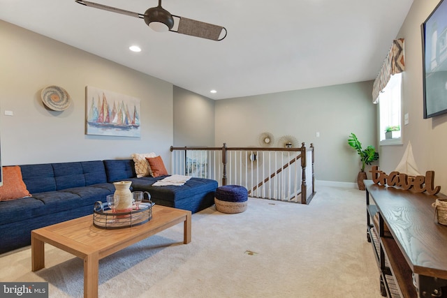 living room featuring ceiling fan and light colored carpet