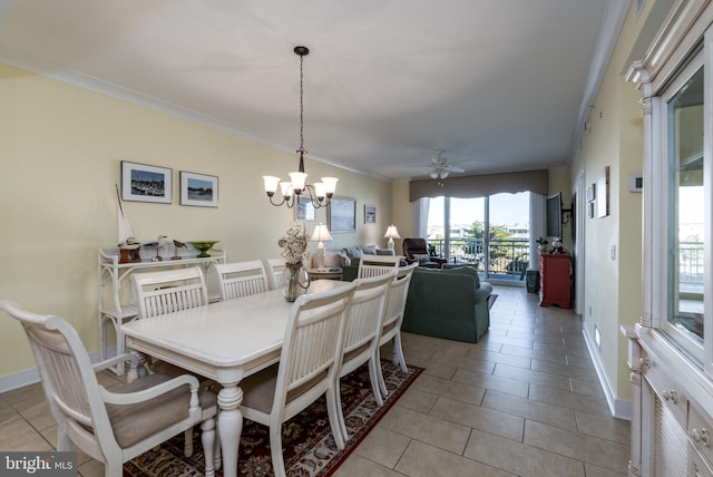 dining area featuring crown molding, light tile patterned floors, and ceiling fan with notable chandelier