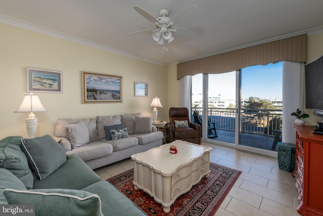 living room featuring ceiling fan, light tile patterned flooring, and ornamental molding