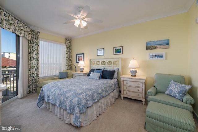 carpeted bedroom featuring ceiling fan, access to exterior, and crown molding