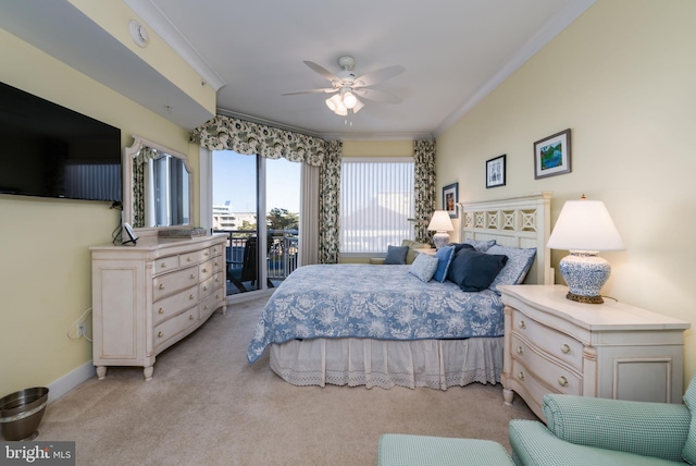 carpeted bedroom with access to outside, ceiling fan, and crown molding