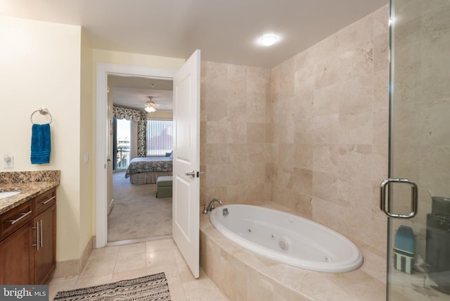 bathroom featuring tile patterned flooring, shower with separate bathtub, vanity, and ceiling fan