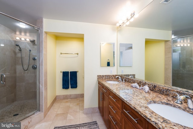 2 48th St Unit 214, Ocean City, MD 21842 - bathroom featuring a stall shower, double vanity, and tile patterned flooring