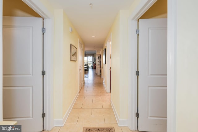 hallway featuring light tile patterned floors