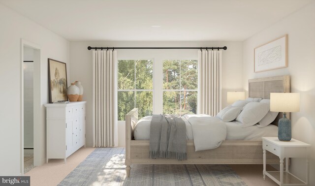 bedroom with light colored carpet