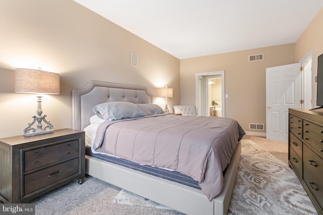 bedroom featuring light carpet