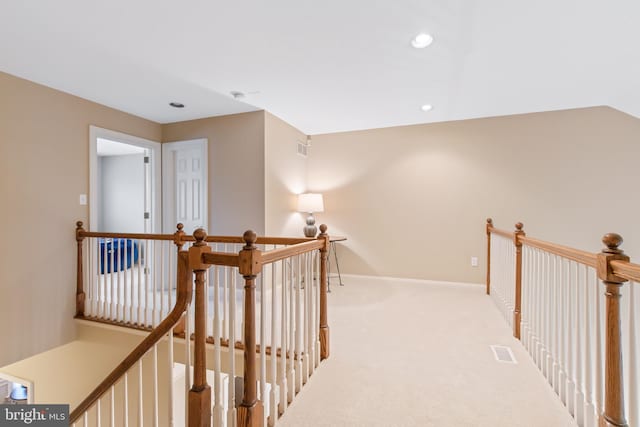 hallway with light carpet