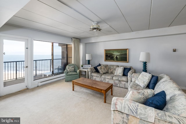 carpeted living room featuring a water view, a baseboard radiator, and ceiling fan