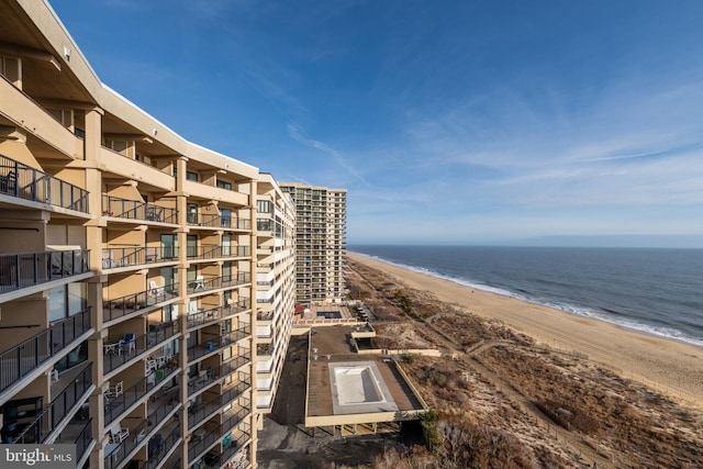 view of home's community with a view of the beach and a water view