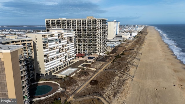 bird's eye view with a beach view and a water view