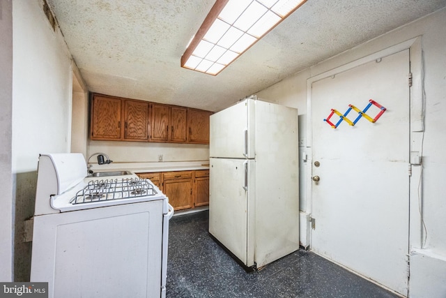 kitchen with sink and white appliances