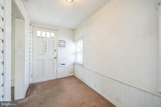 view of carpeted entrance foyer