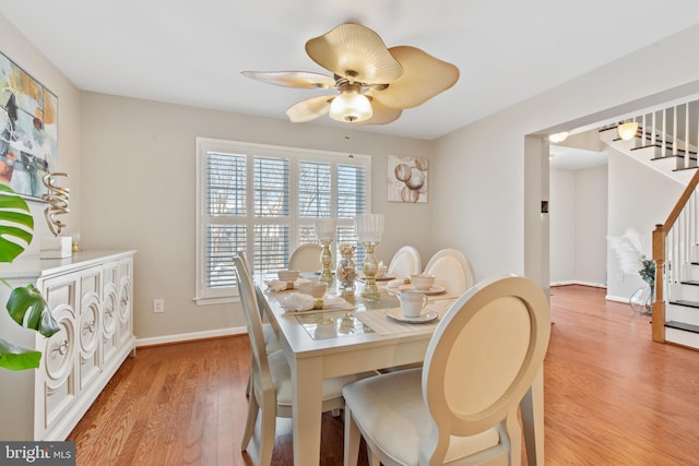 dining area featuring hardwood / wood-style flooring and ceiling fan