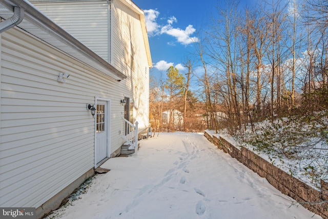 view of yard layered in snow