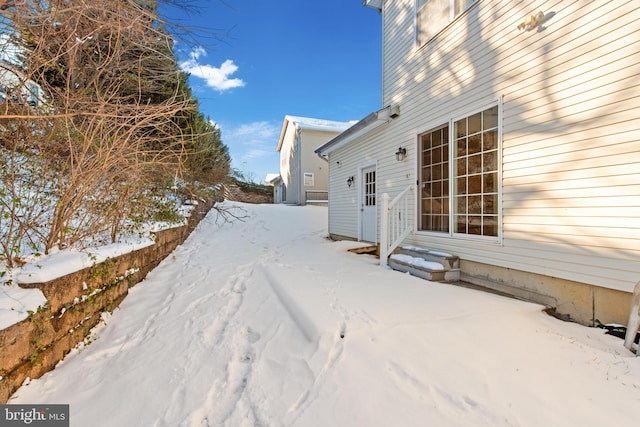 view of yard layered in snow