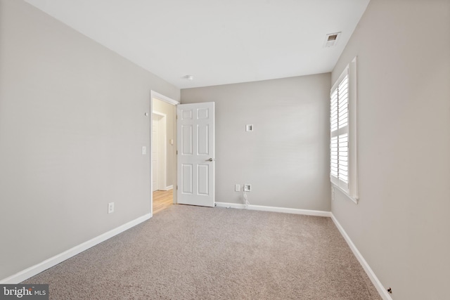 empty room featuring carpet flooring