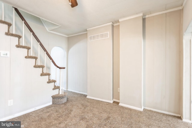 basement featuring carpet flooring and ornamental molding