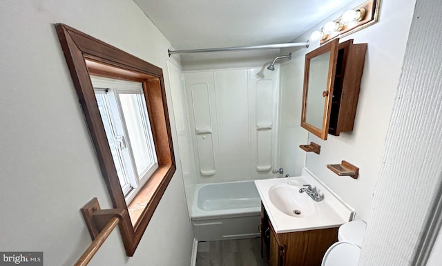 full bathroom with vanity, toilet, shower / tub combination, and wood-type flooring