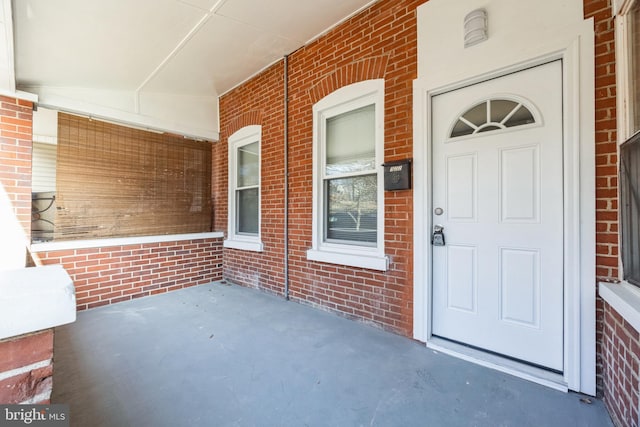 entrance to property with covered porch