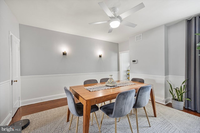 dining room with ceiling fan and wood-type flooring