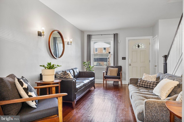 living room with dark hardwood / wood-style flooring