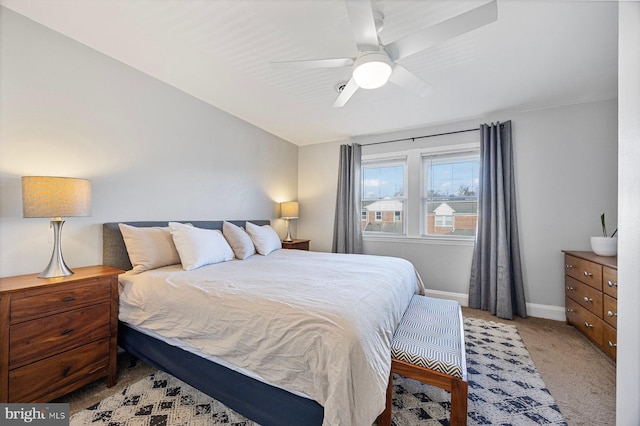 bedroom featuring light carpet and ceiling fan