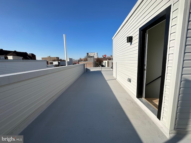 view of patio featuring a balcony