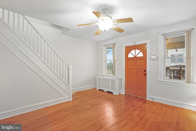 entryway featuring radiator, ceiling fan, and light hardwood / wood-style floors