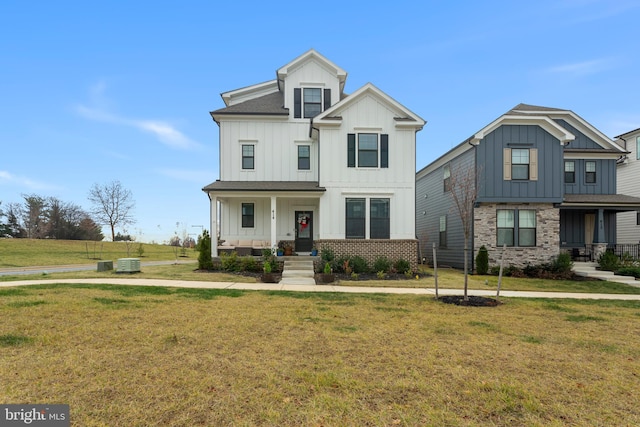 view of front of property featuring a front lawn and cooling unit