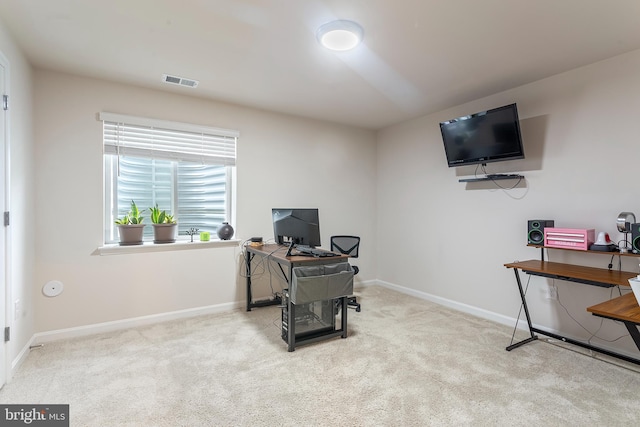 office area featuring light colored carpet