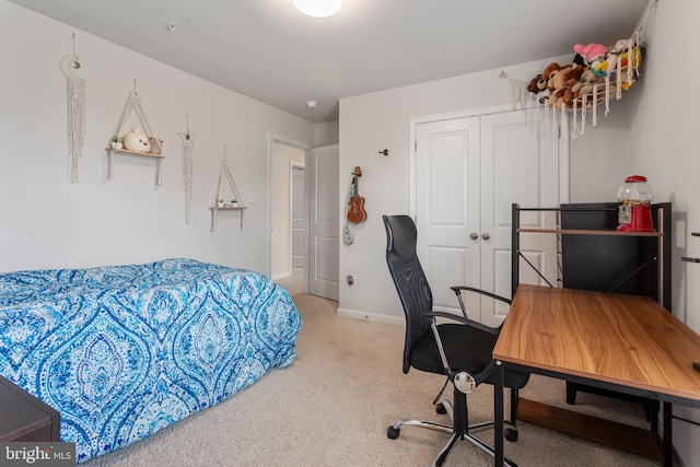 carpeted bedroom with a closet