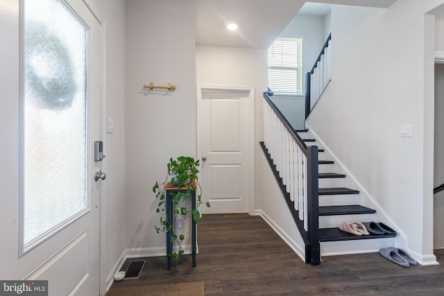 foyer entrance with dark wood-type flooring