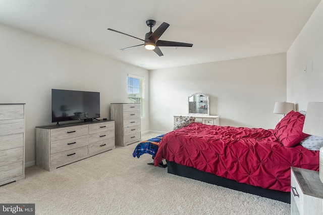 bedroom featuring light carpet and ceiling fan