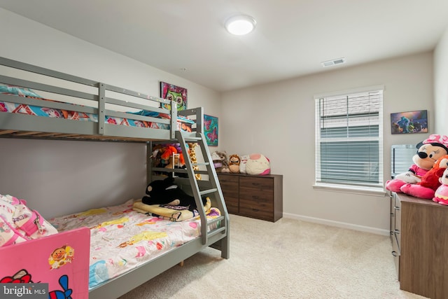 bedroom featuring light carpet