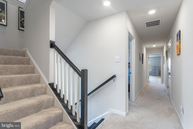 stairway with carpet flooring