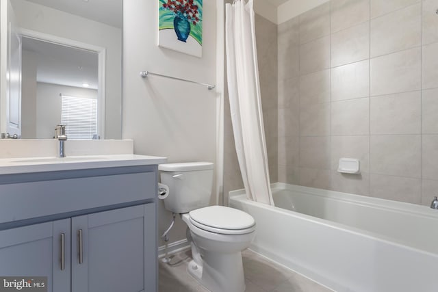 full bathroom featuring tile patterned flooring, vanity, toilet, and shower / tub combo