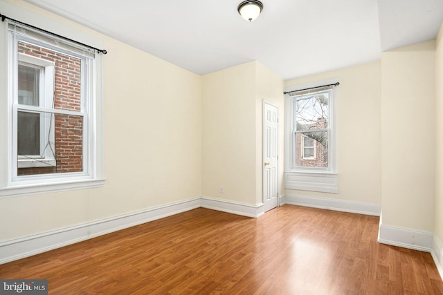 spare room featuring light hardwood / wood-style floors